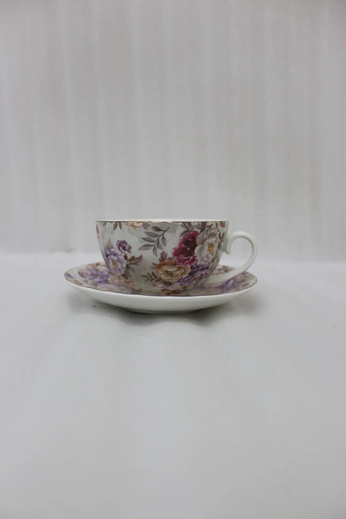 Elegant Ceramic Tea Cup and Saucer Set with Golden Stand